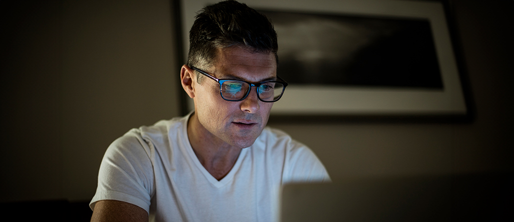 man looking at computer