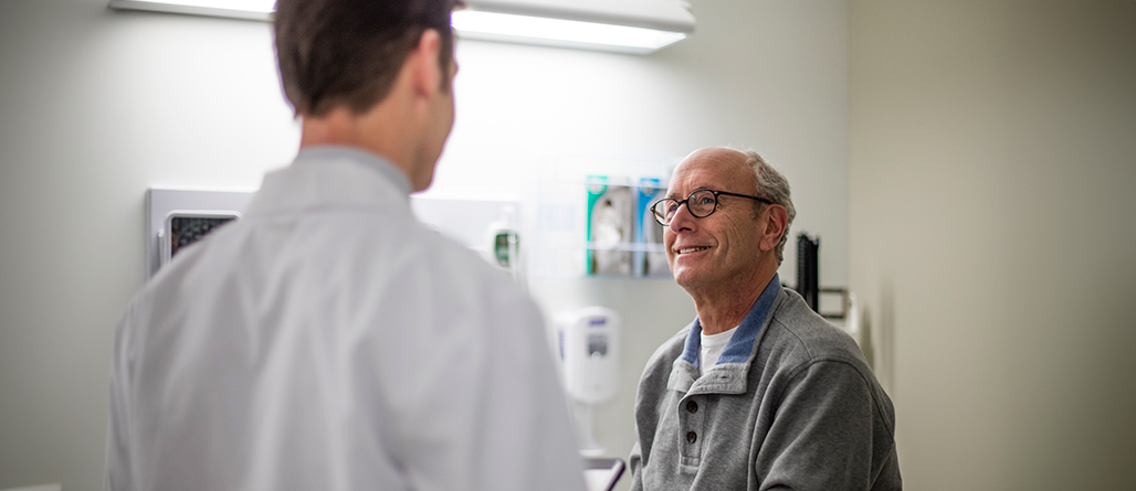 doctor talking to older man