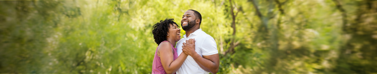 couple laughing together and holding hands