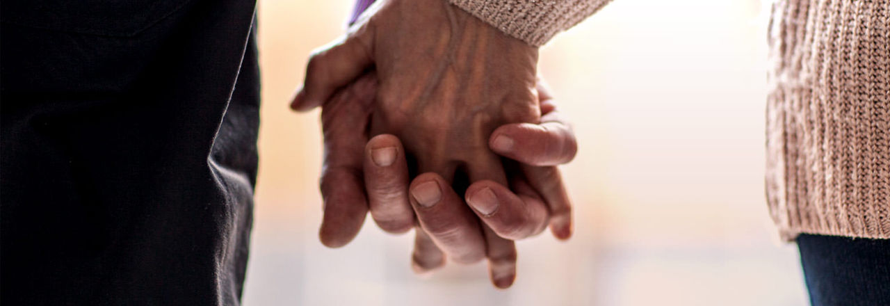 Two people holding hands.